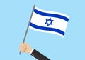 Israel waving flag. Hand holding Israeli flag. National symbol with David Star. Vector illustration